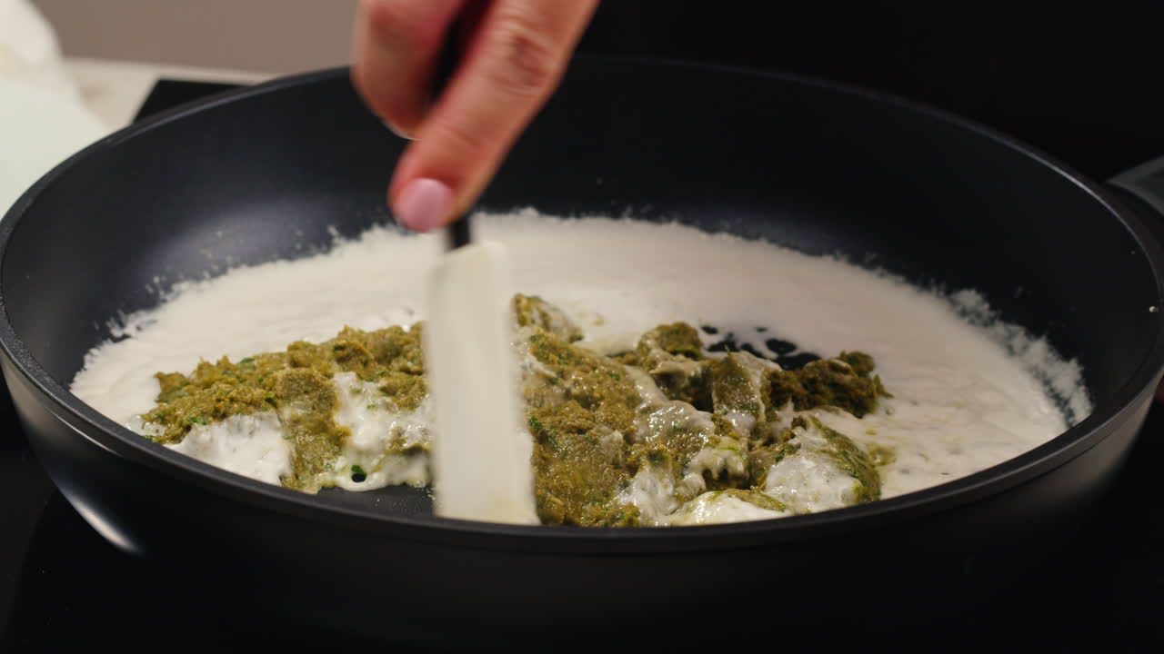 Cooking Pesto Cream Sauce in a Pan
