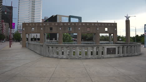 establishing shot of the 'welcome to houston' sign in downtown houston, texas