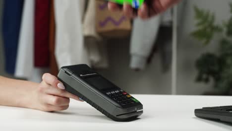 payment by smartphone with chroma green screen via terminal without entering the pin code, contactless paying while shopping to observe safety protection, using mobile phone making transaction