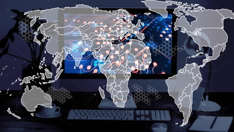 animación de un mapa del mundo en una pantalla de computadora con una placa de circuito de computadora