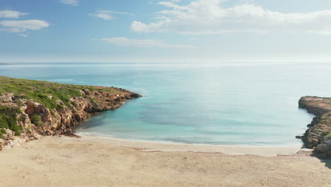 Scenic-View-Of-Calamosche-Beach-Against-Blue-Sky-In-Vendicari-Natural-Reserve,-Sicily,-Italy---aerial-drone-shot