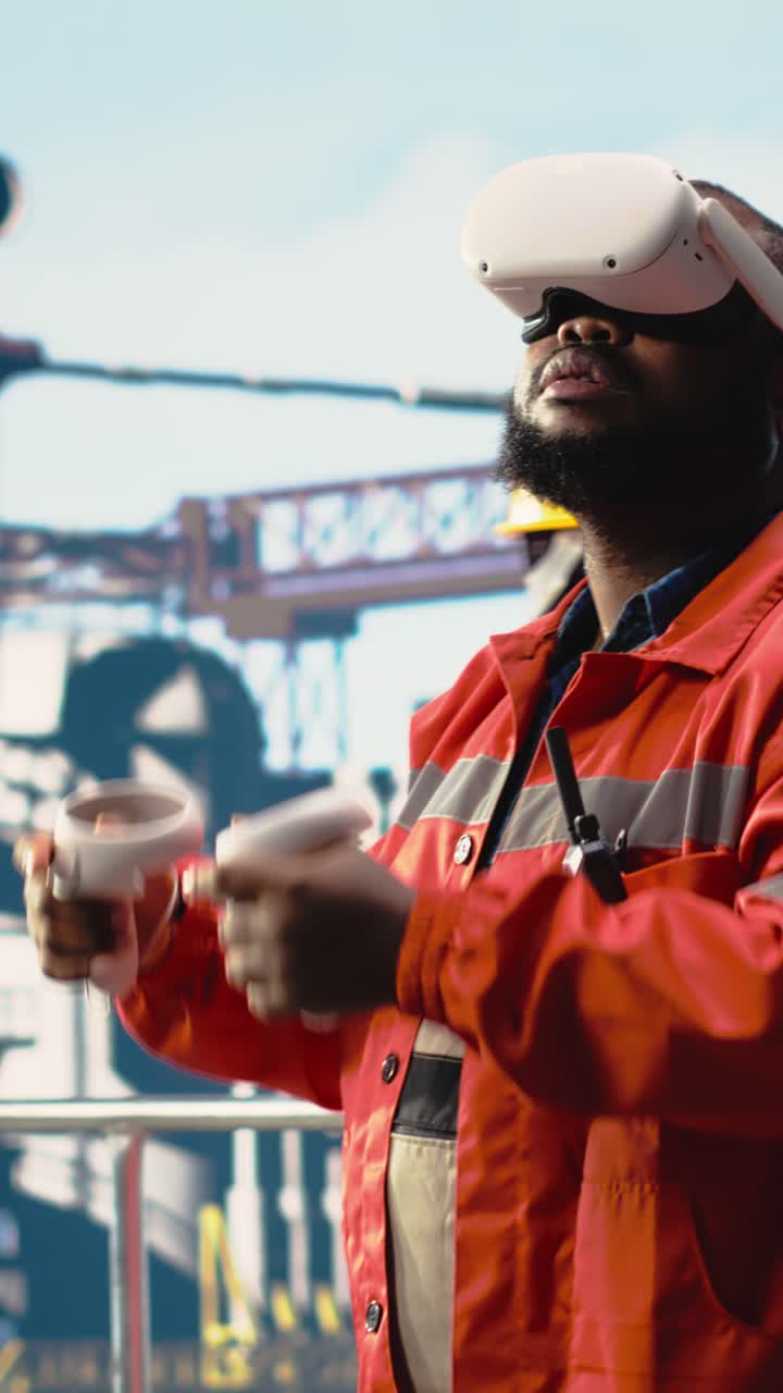 Vertical video Offshore platform technician wearing VR googles coordinating operation