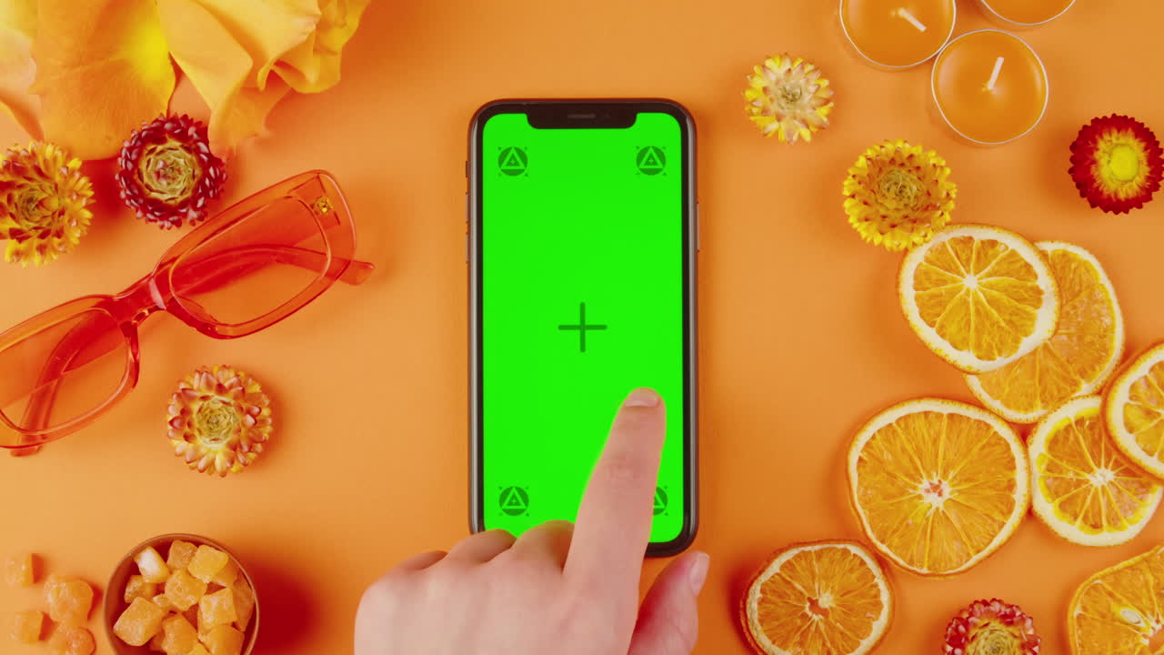 Orange Themed Flat Lay with Phone and Green Screen