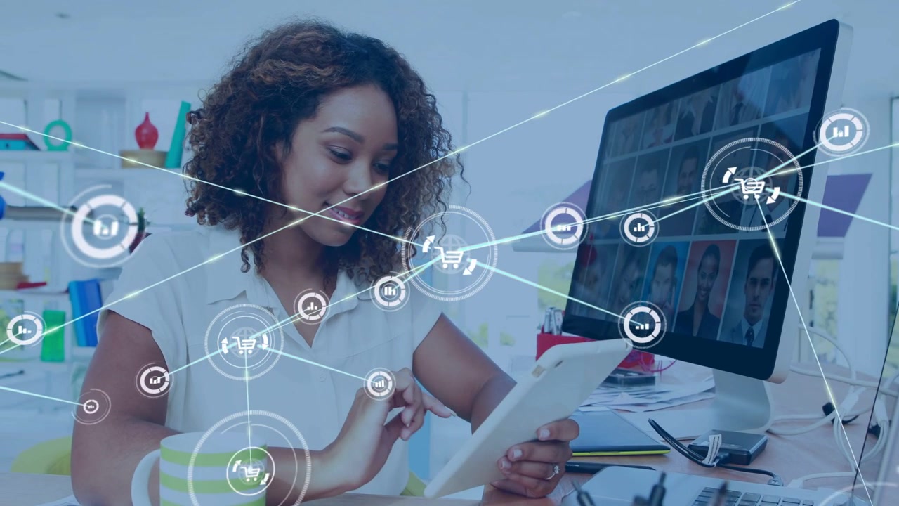 Woman tapping tablet, starting node then spokes then icons spreading across desk to show analytics