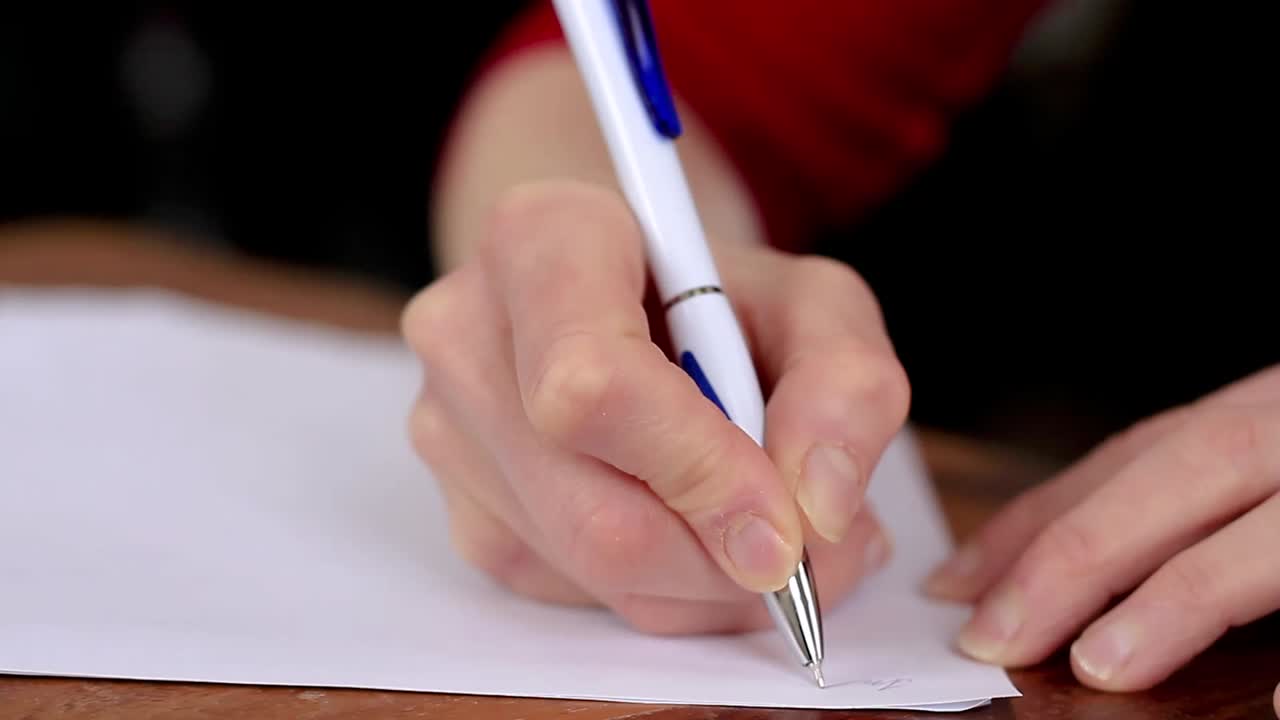 woman writing notes on an office table stock video stock footage