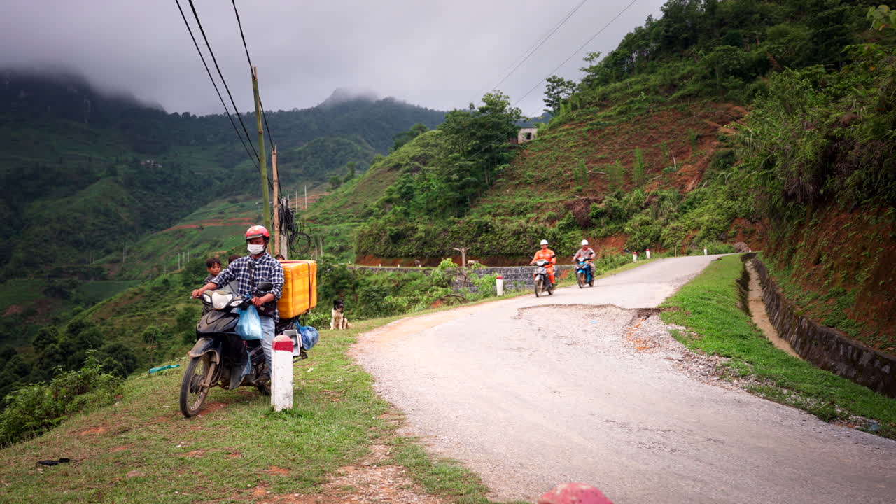 Food Bike Vendors In Rural Town Along Ha Giang Loop In Vietnam. Static Shot