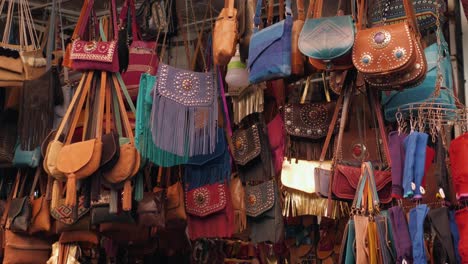 handmade leather bags for sale at a market