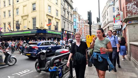 crowded street with pedestrians and vehicles