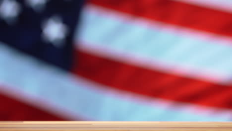 air force military rank stripes discarded for an alcoholic drink with a us flag in the background