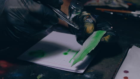 painting workshop man painting detailed 3d printed with an airbrush close shot