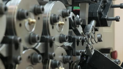 the work of the machine for the production of springs, conveyor drum type