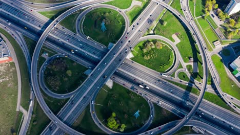 timelapse aerial view of a freeway intersection traffic trails in moscow.