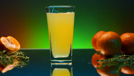 glass of orange juice with mandarin oranges