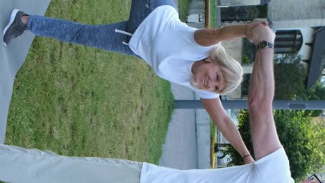 senior couple doing fitness in summer park in the morning senior couple doing fitness in summer park in the morning pensioners healthy lifestyle