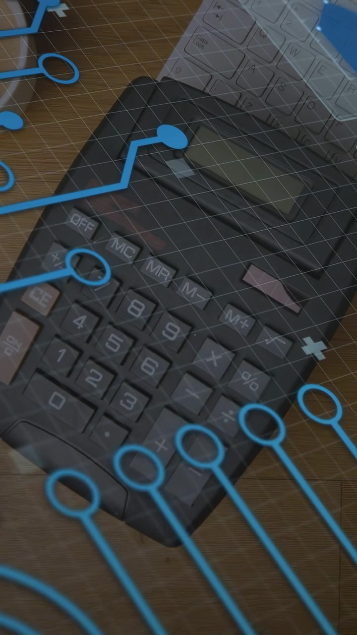 Vertical video: Camera tilt revealing black calculator blue lines shifting over desk to reveal keys