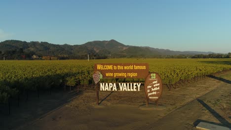 pan down aerial shot of the welcome to the napa valley sign