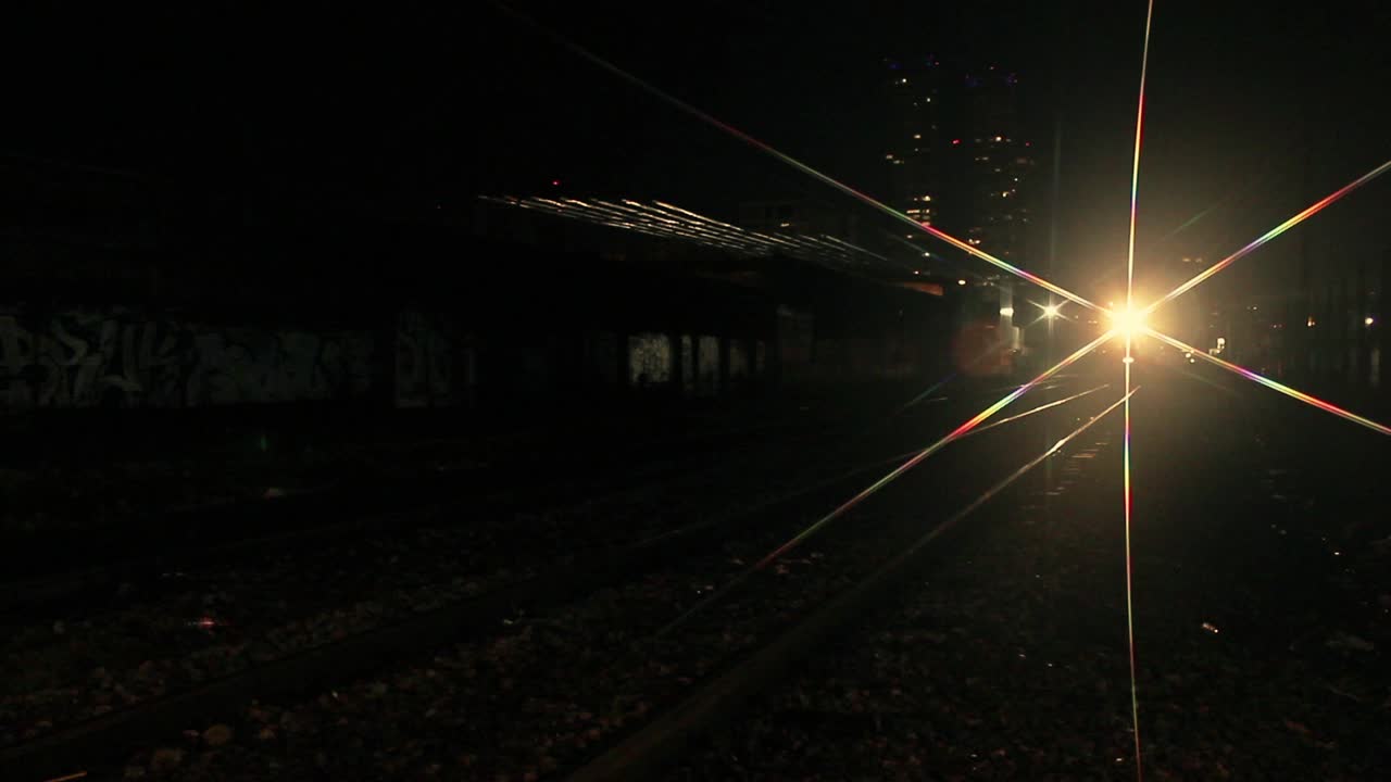 Fast Train Approaching and Passing on Tracks at Night