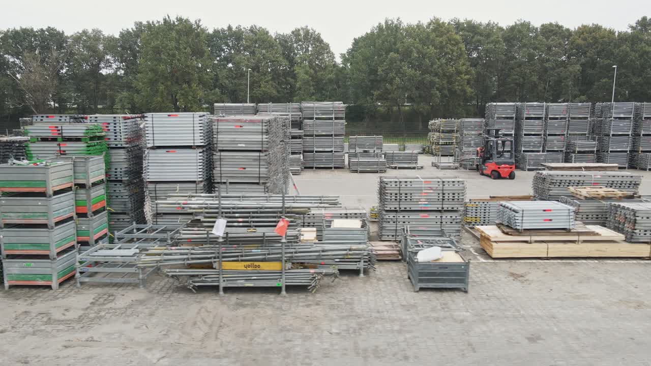 Fast dolly of construction materials stacked up on an industrial storage yard