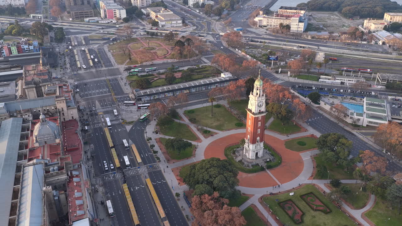 Aerial drone view of Torre Monumental in Buenos Aires, showing surrounding avenues, urban traffic, and city architecture from above