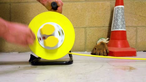 extension lead drum being reeled in