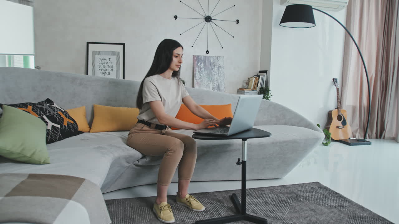 Beautiful Young Woman Working On Laptop From Home
