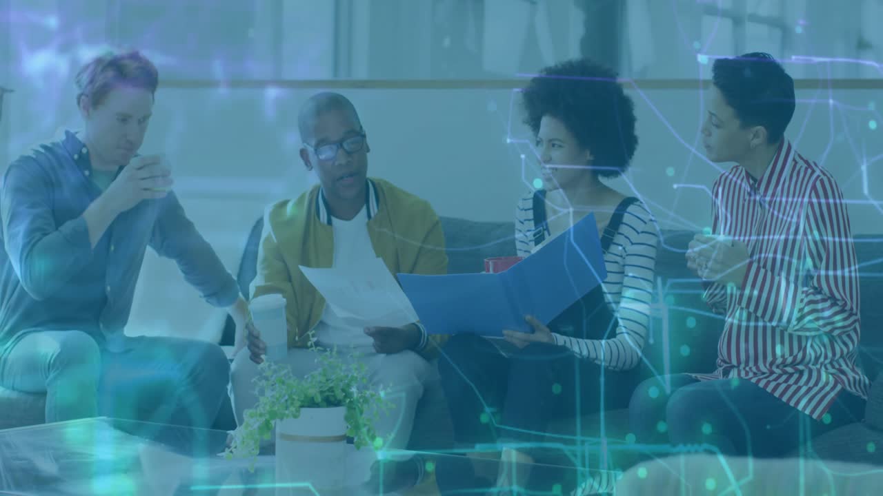 Four coworkers holding coffee reviewing reports in business meeting with animated network overlay