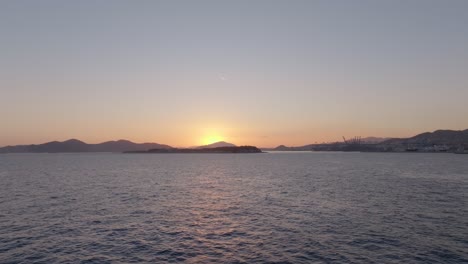 sunset over the sea in piraeus, athens, greece