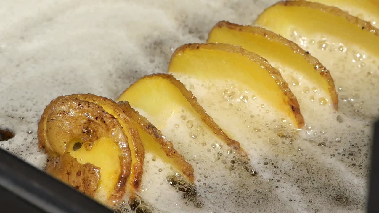 Spiral Cut Fries Frying in Oil