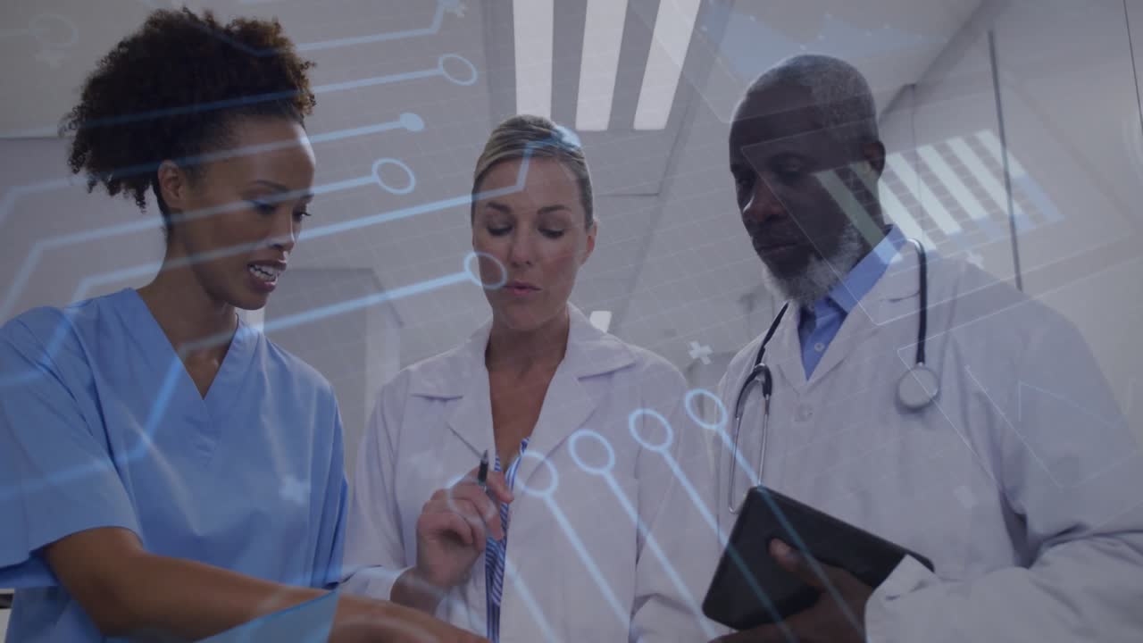 Medical team pointing at charts using tablet as transparent overlay appearing fading for analysis