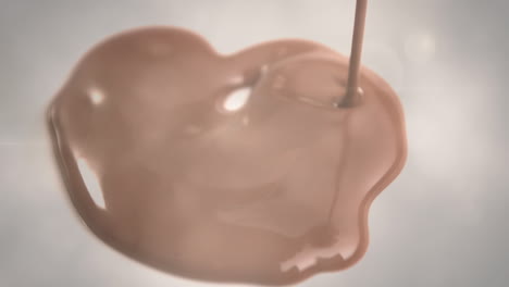 animation of light over melted milk chocolate pouring