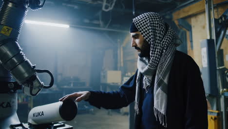 industrial robot and worker in a workshop