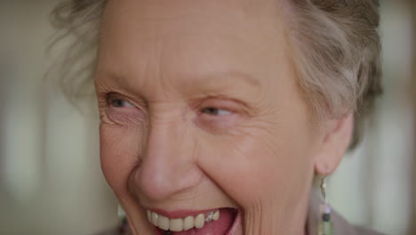 close up portrait of cheerful elderly woman laughing happy enjoying retirement lifestyle satisfaction senior pensioner