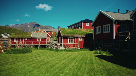 panoramic view of the red wooden fishermen cabins in the lofoten islands, norway. view of the picturesque landscape in the background