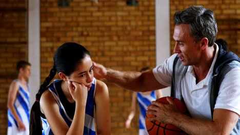 Basketball-coach-explaining-to-schoolgirl-4k