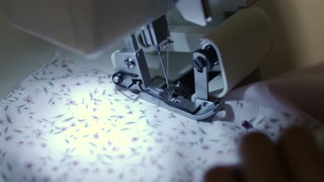 close up footage of sewing machine at night time