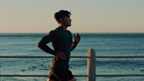 Ocean,-sky-and-man-running-for-fitness-health