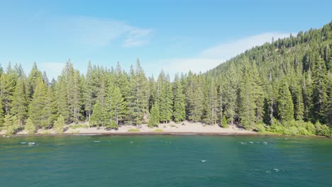 aerial push in footage provides a tranquil look at china cove’s shoreline where lake and land quietly meet.