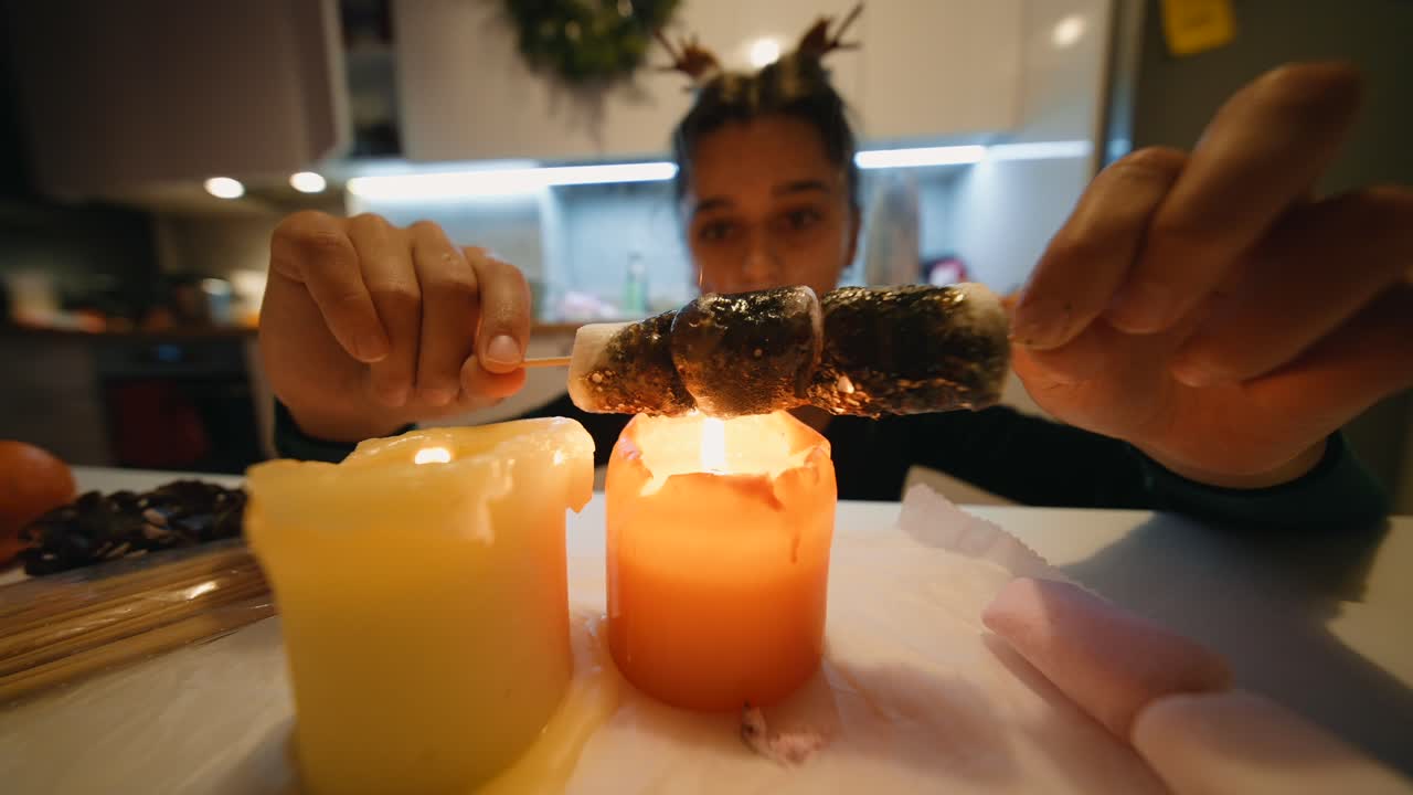 Roasting Marshmallows over Candles