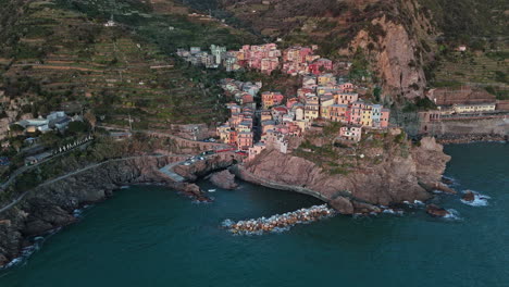 colorful buildings nestled along the cliffside in the stunning coastal town of manarola