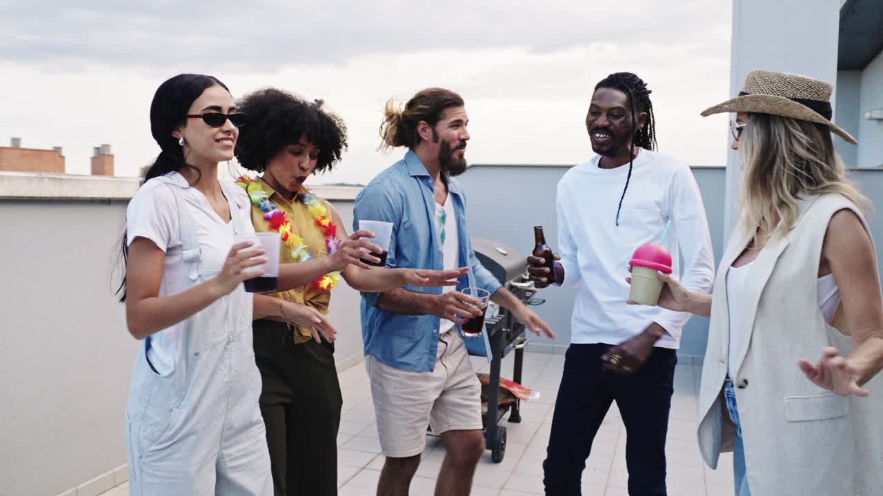 Friends enjoying a rooftop party with drinks