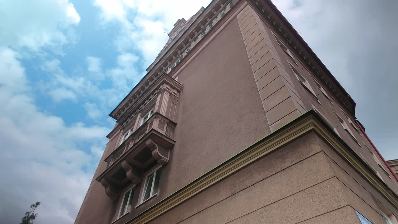 Looking up at Ornate Bay window on Soviet style urban apartment block