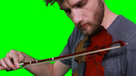 close-up of male musician playing violin