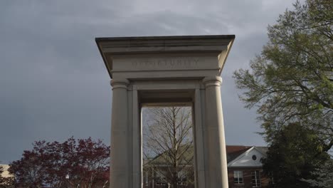 James-Meridith-statue,-American-civil-rights-leader,-on-the-campus-of-Ole-Miss-in-Oxford,-Mississippi-with-video-tilting-down