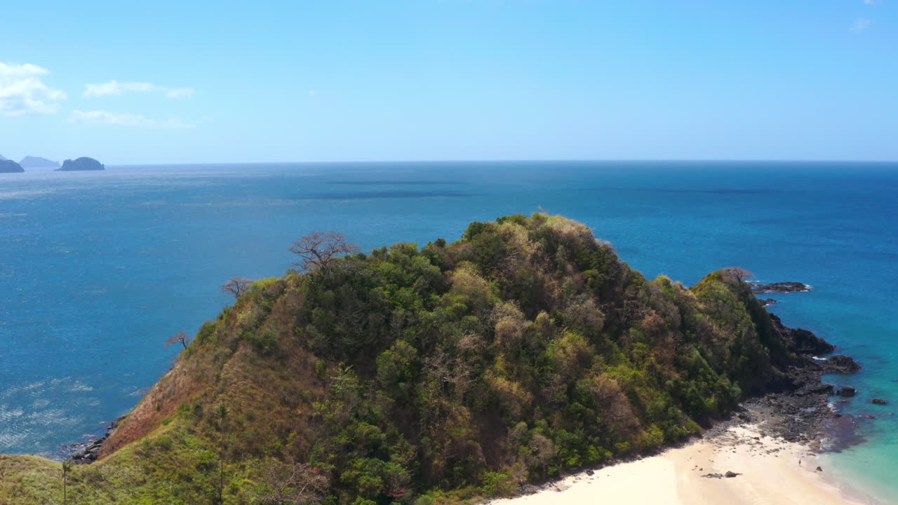Tropical Island Landscape with Ocean and Lush Green Hills
