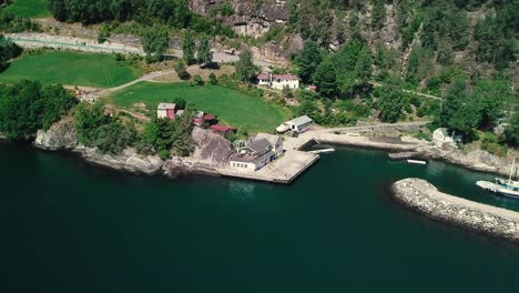 Dolly-and-crane-down-aerial-shot-of-a-small-harbor-in-Norway