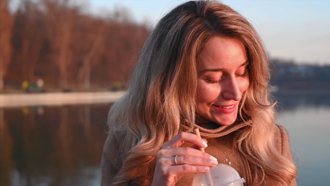 Young beautiful woman wipes the coffee drops from her coat