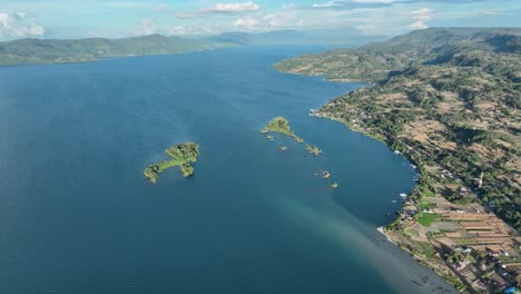 samosir island in sumatra with clear blue waters and lush landscapes, aerial view