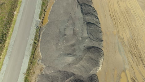 aerial view of sand pile along the road in gdynia