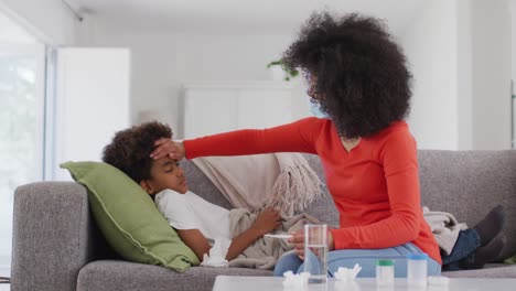 mother taking care of her sick son at home