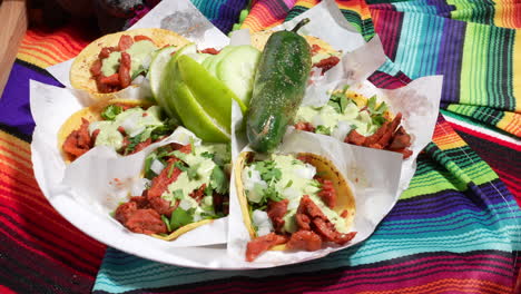 plate of pulled pork street tacos, lime, chili pepper - food truck series